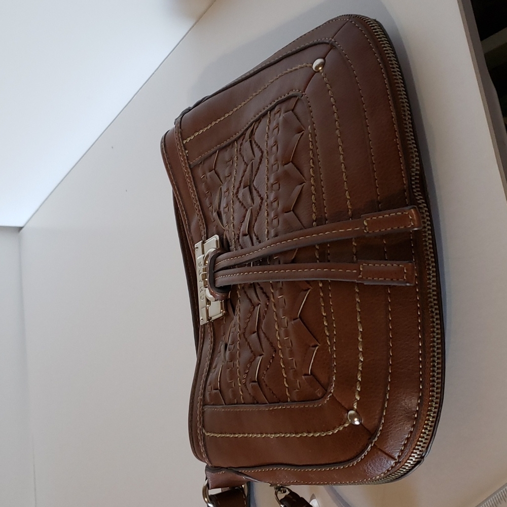 Chaps shoulder bag with clever bottom zipper to expand capacity.  Lovely leather